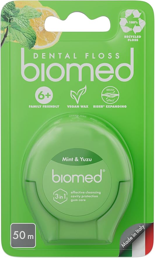 BIOMED Mint and Yuzu flavored dental floss dispenser on a clean background.