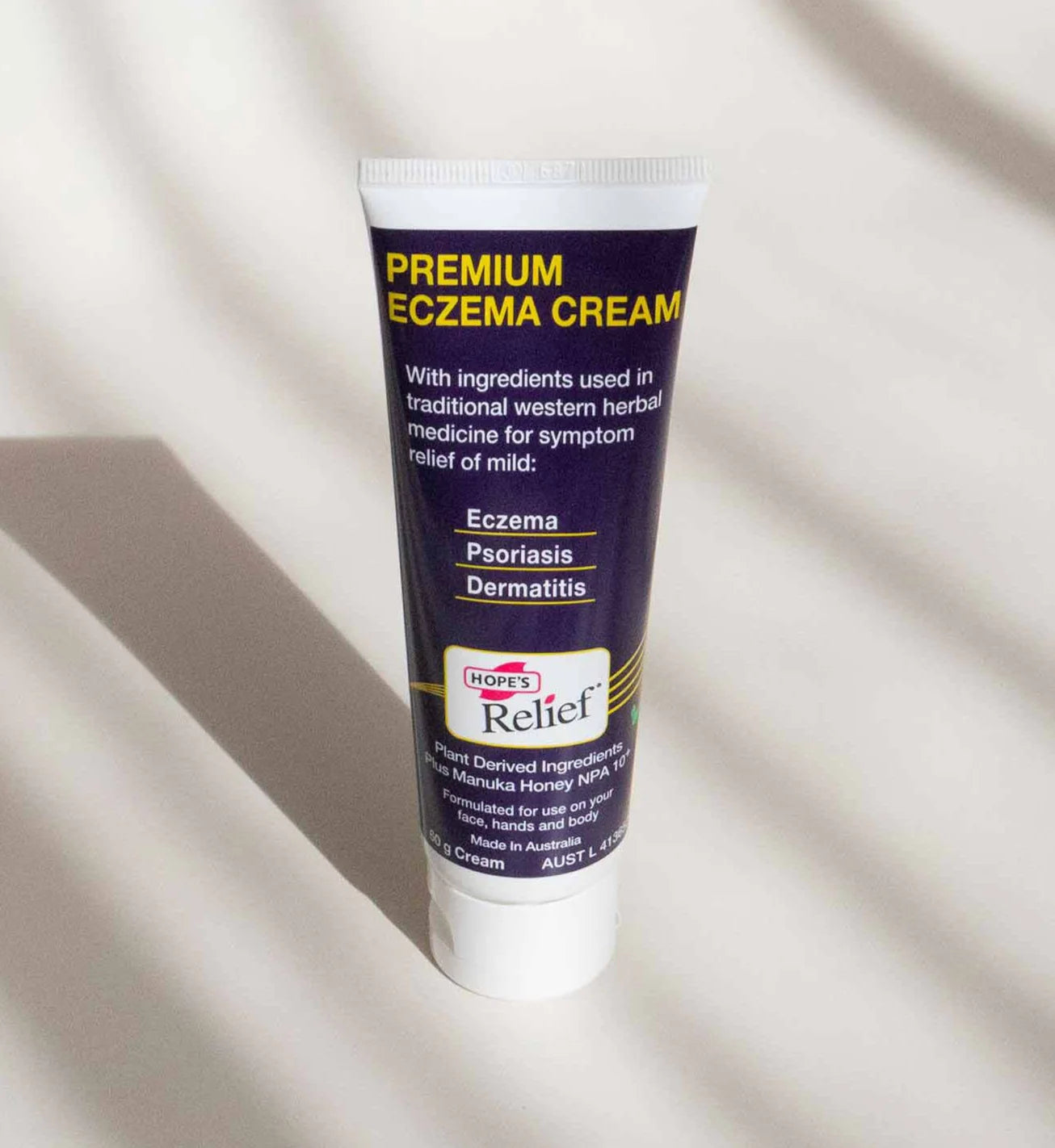 Tube of Hope's Relief Premium Eczema Cream on a beige background