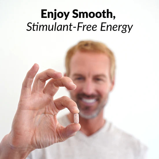 Hand holding a pill with text 'Enjoy Smooth, Stimulant-Free Energy' on a white background