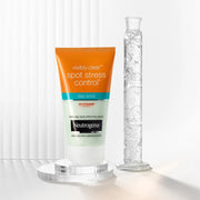 Neutrogena Visibly Clear Daily Scrub 150ml tube, blue and white packaging, isolated on white.