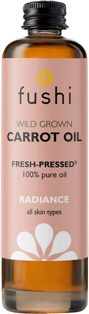 Bottle of fushi Wild Grown Carrot Oil with a pink label