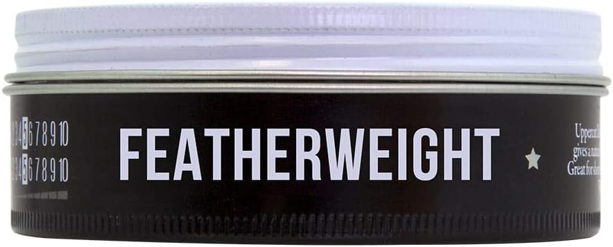 Side image: Uppercut Deluxe Featherweight Fiber Paste 70g jar firm hold styling paste packaging