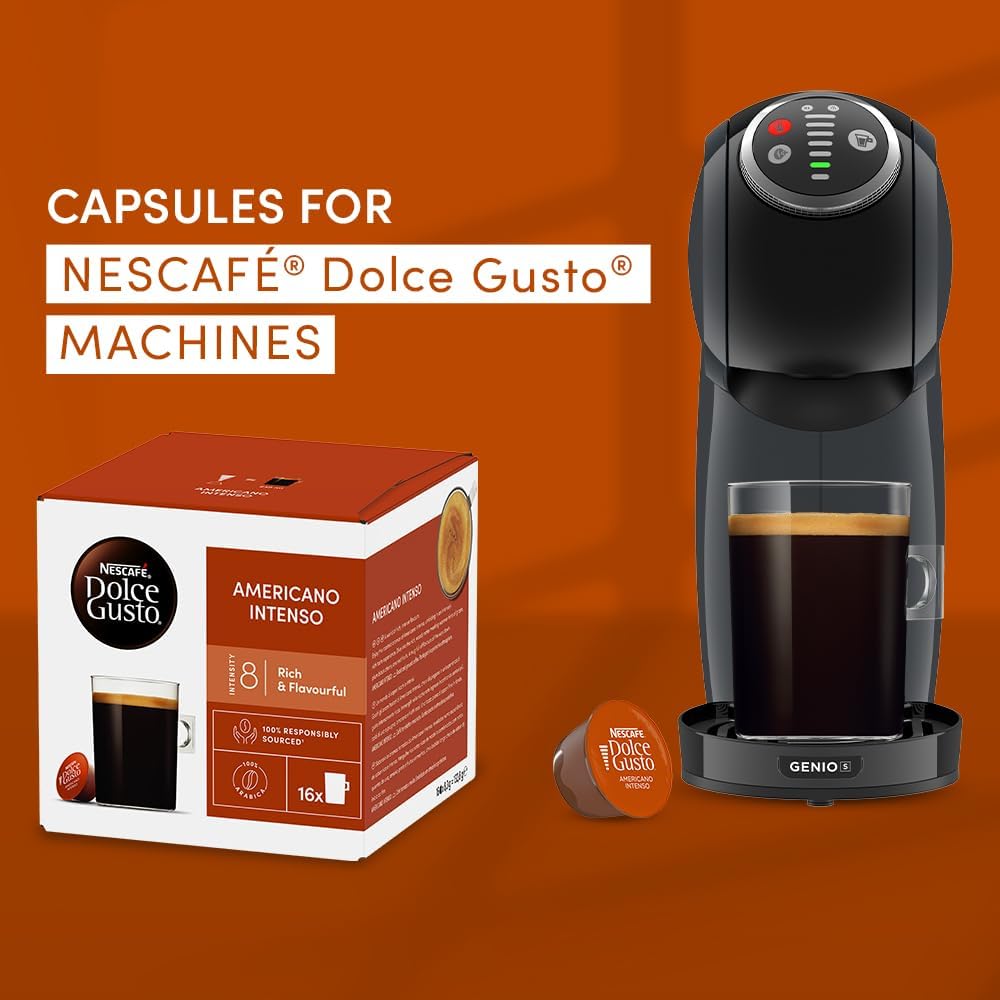 A large mug of black coffee next to a Dolce Gusto machine and a pod.