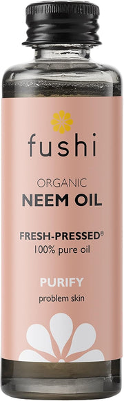 Fushi Organic Neem Oil bottle with pink label on a white background