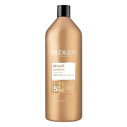 Redken All Soft Conditioner bottle with Argan Oil, 1000ml, on white background.