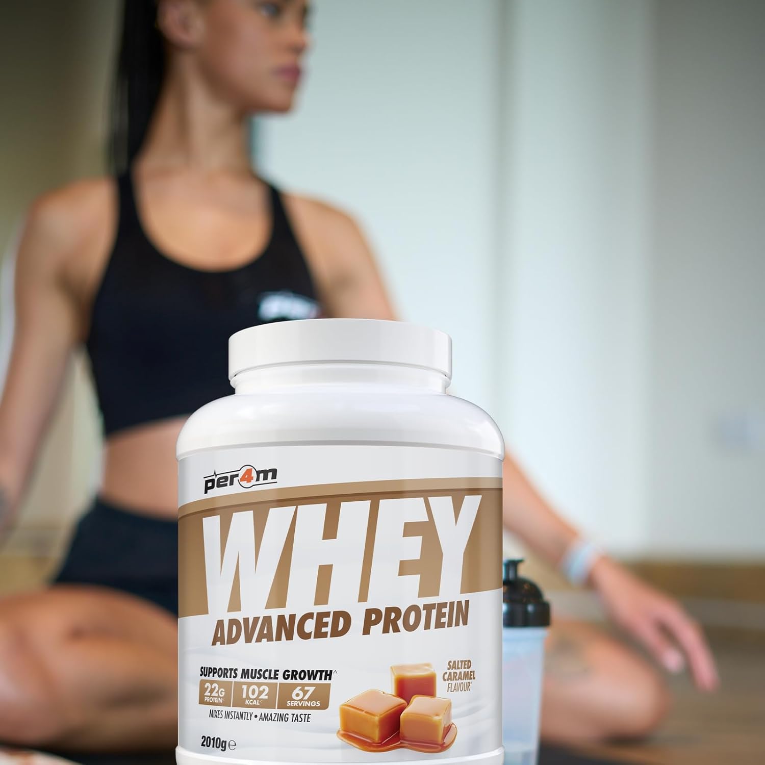 Whey protein supplement bottle with a blurred person in the background