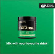 Optimum Nutrition Micronised Creatine Powder container on a green background