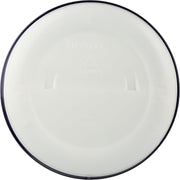 Round white plate with a dark rim on a white background