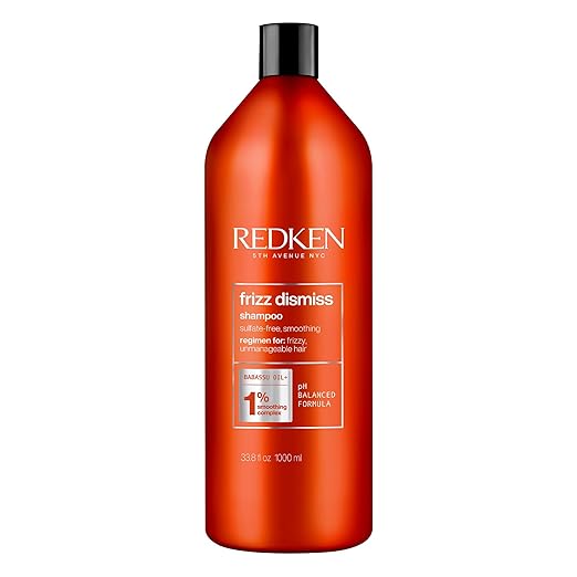 Redken Frizz Dismiss Shampoo bottle, sulfate-free, 1000ml on white background.