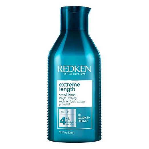 Redken Extreme Length Biotin Conditioner bottle, 300ml, on white background.