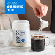 In Use: Scoop of unflavoured collagen powder next to a shaker bottle.