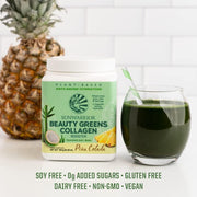 Sunwarrior Beauty Greens Collagen Superfood Drink next to a full glass