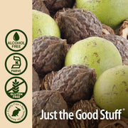 Close-up of green and brown walnuts with 'Just the Good Stuff' branding and certification logos on a beige background.
