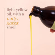 Brown bottle pouring light yellow oil with text on a beige background