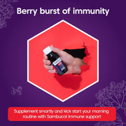 Hand holding a bottle labeled 'Sambucol' against a purple background with text about immune support.