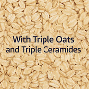 Close-up of oats with text 'With Triple Oats and Triple Ceramides' on a beige background