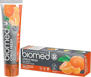 Greey & orange tube & box of BIOMED Citrus Fresh Natural Toothpaste on a clean background.