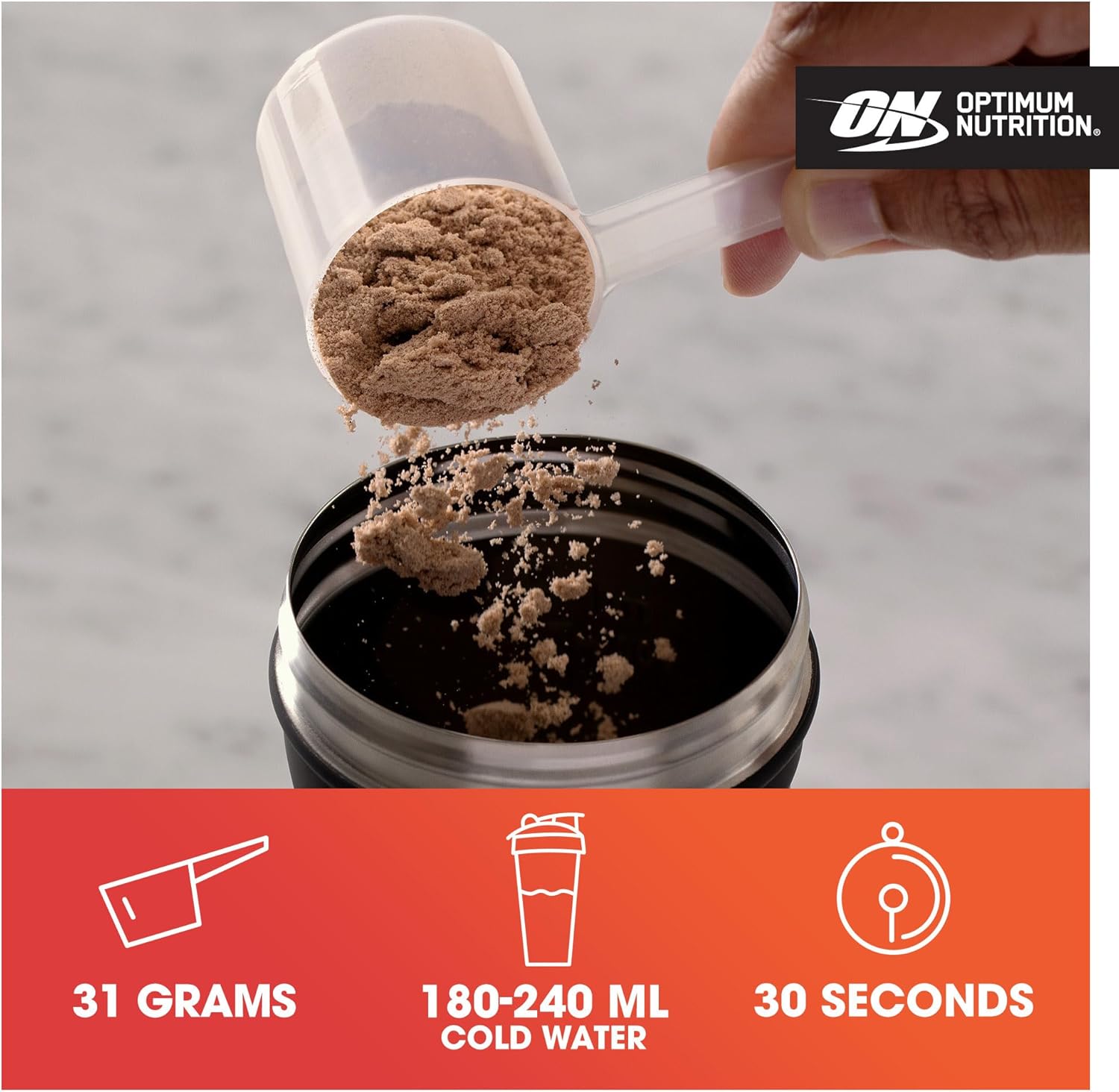 Person scooping protein powder from a container with Optimum Nutrition logo.