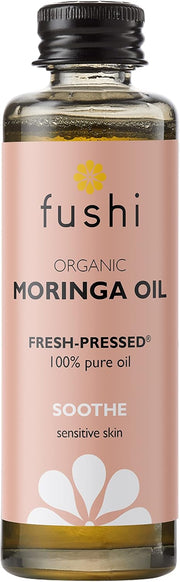 Fushi Organic Moringa Oil bottle with pink label on a white background