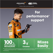 Person in orange racing suit holding a supplement container with McLaren and Optimum Nutrition branding.