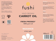 Fushi Wild Grown Carrot Oil label on a pink background