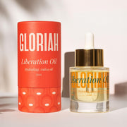 Gloriah Liberation Oil packaging with red container and dropper bottle on a light background