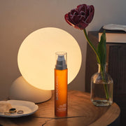 Moroccanoil Night Body Serum, pump bottle packaging, fragranced formula, 100ml, evening body skincare use