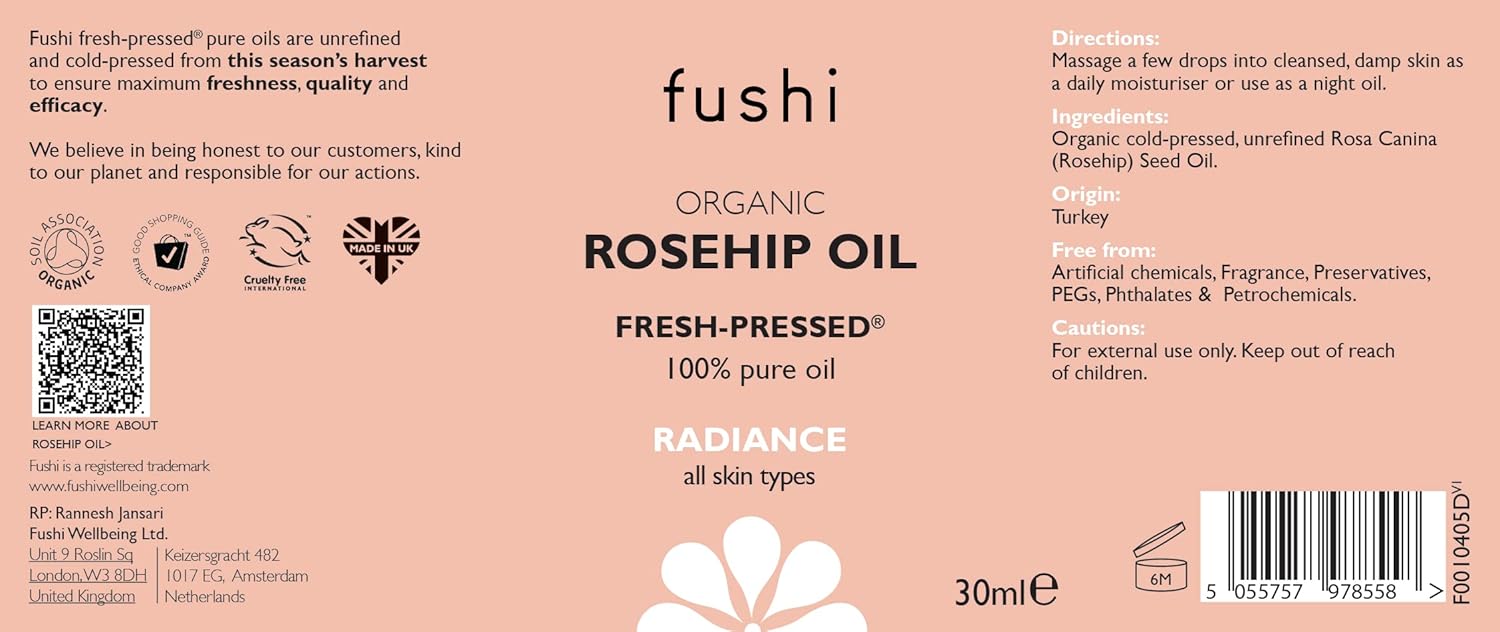Fushi Organic Rosehip Oil label on a pink background