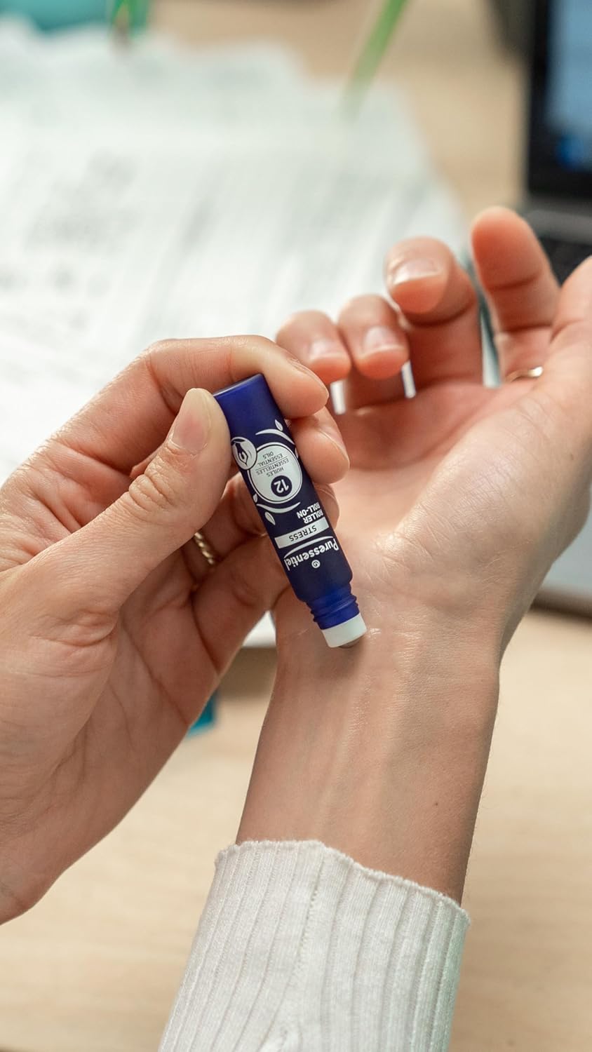 Hand applying Puressentiel roll-on to wrist for soothing massage.