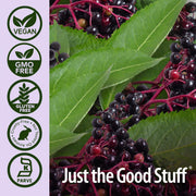 Close-up of elderberries with green leaves and certification icons on a purple background, featuring the brand 'Just the Good Stuff'.