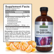 Liquid CO-Q10 supplement bottle with supplement facts label and mandarin oranges on a beige background