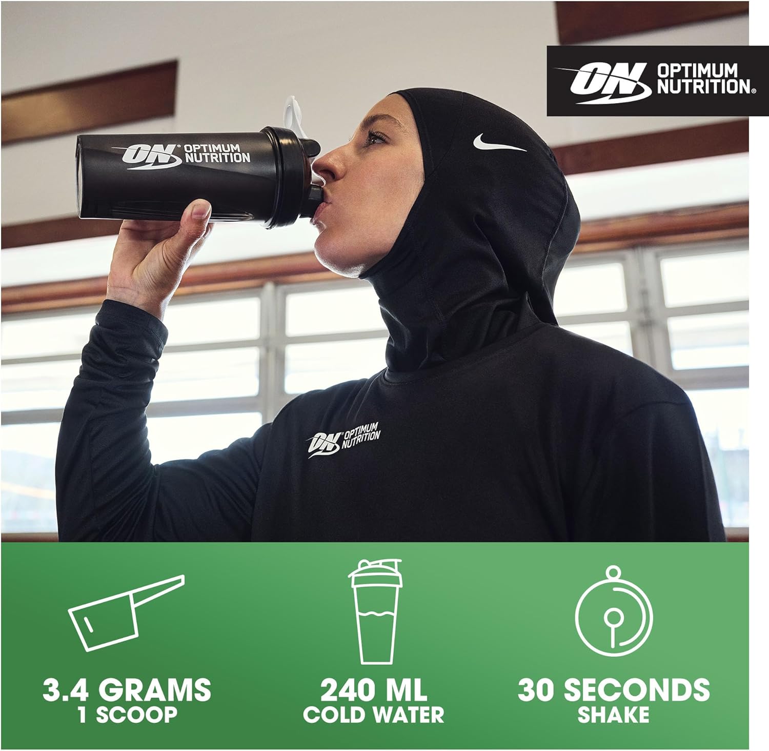 Person drinking from an Optimum Nutrition shaker bottle with product details below.