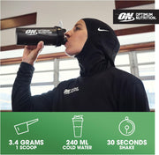 Person drinking from an Optimum Nutrition shaker bottle with product details below.