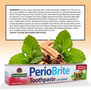 PerioBrite Toothpaste packaging with mint leaves and cinnamon sticks on a beige background