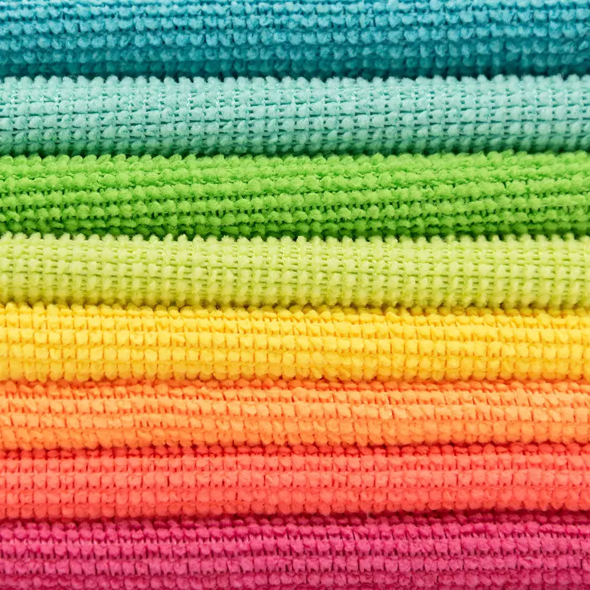 Spontex Microfibre Collection Cleaning Cloths 24 Pack colour shown being used to wipe a household surface