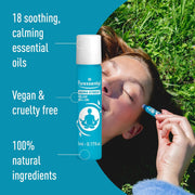 Hand applying Puressentiel roll-on to temple.