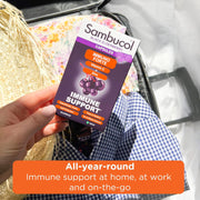 Sambucol immune support product held by a hand with text about全年免疫支持