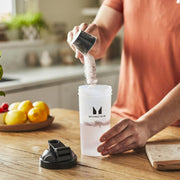 How to Use: Shaker bottle with Myprotein Clear Whey Isolate powder pouring.