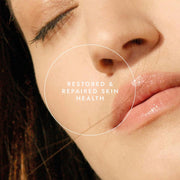 Close-up of a person's face with text 'Restored & Repaired Skin Health' on a beige background