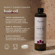 Fushi hair oil bottle with product details on a textured background