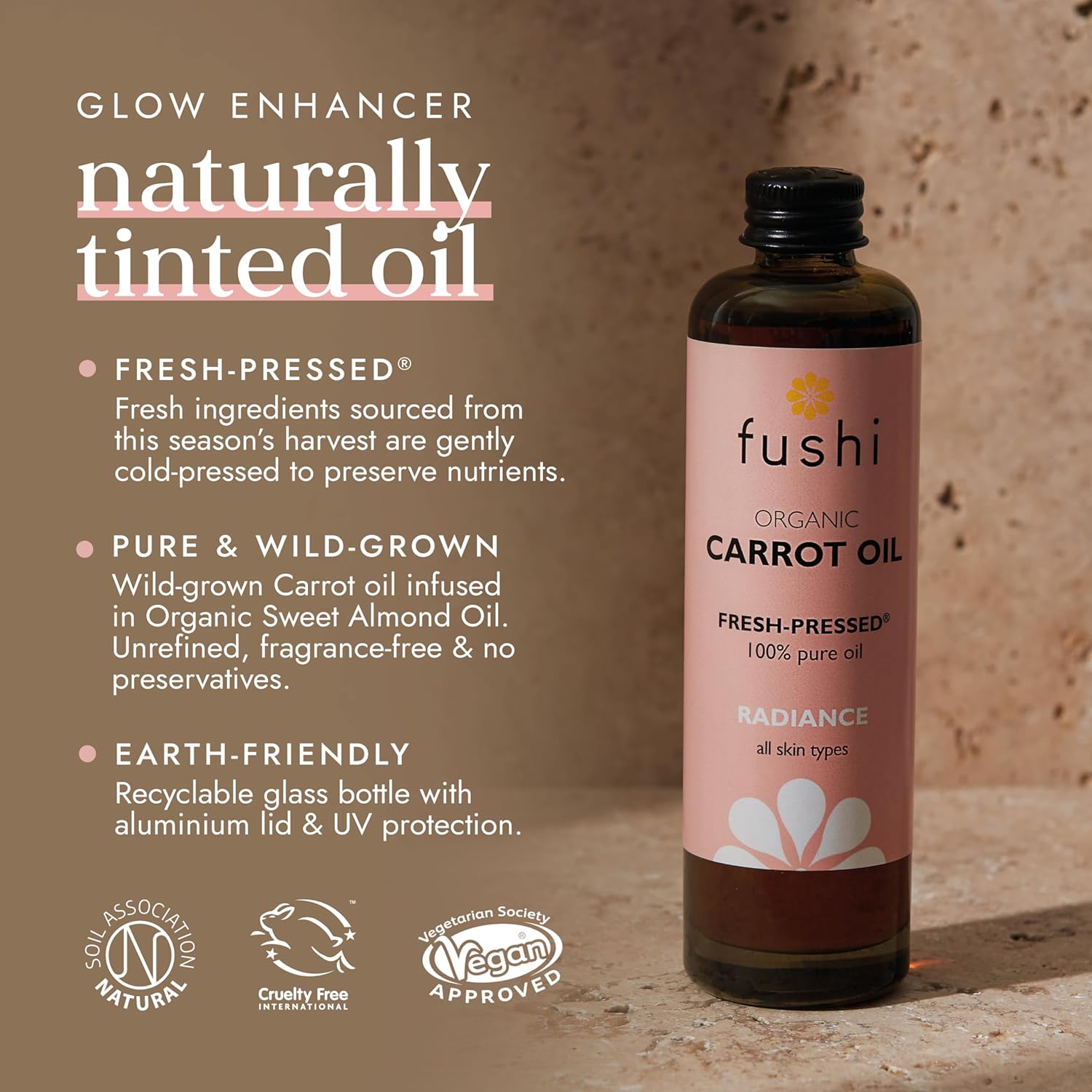 Fushi Organic Carrot Oil bottle with product details on a brown background