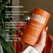 Orange container of GLORIAH Soul Gel held by a hand with text about product features.