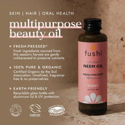 Fushi organic neem oil bottle with product details on a textured background