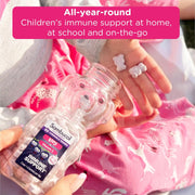 Sambucol immune support product with a child holding it, emphasizing全年-round children's immune support.
