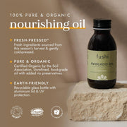 Bottle of fushi Avocado Oil on a stone surface with product details on a brown background