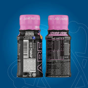 Two energy drink bottles with pink caps on a blue background