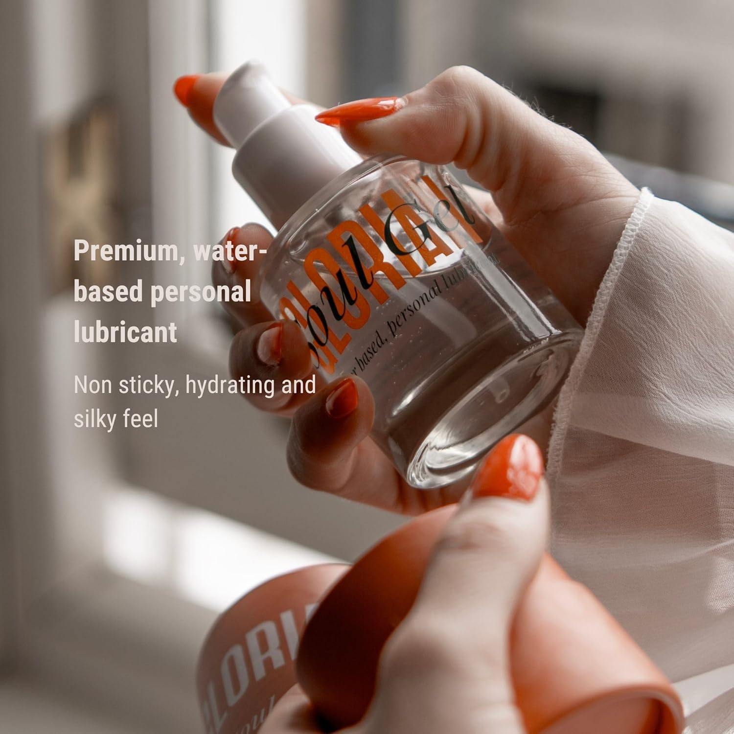 Hand holding a bottle of 'LORI' personal lubricant with product details text.