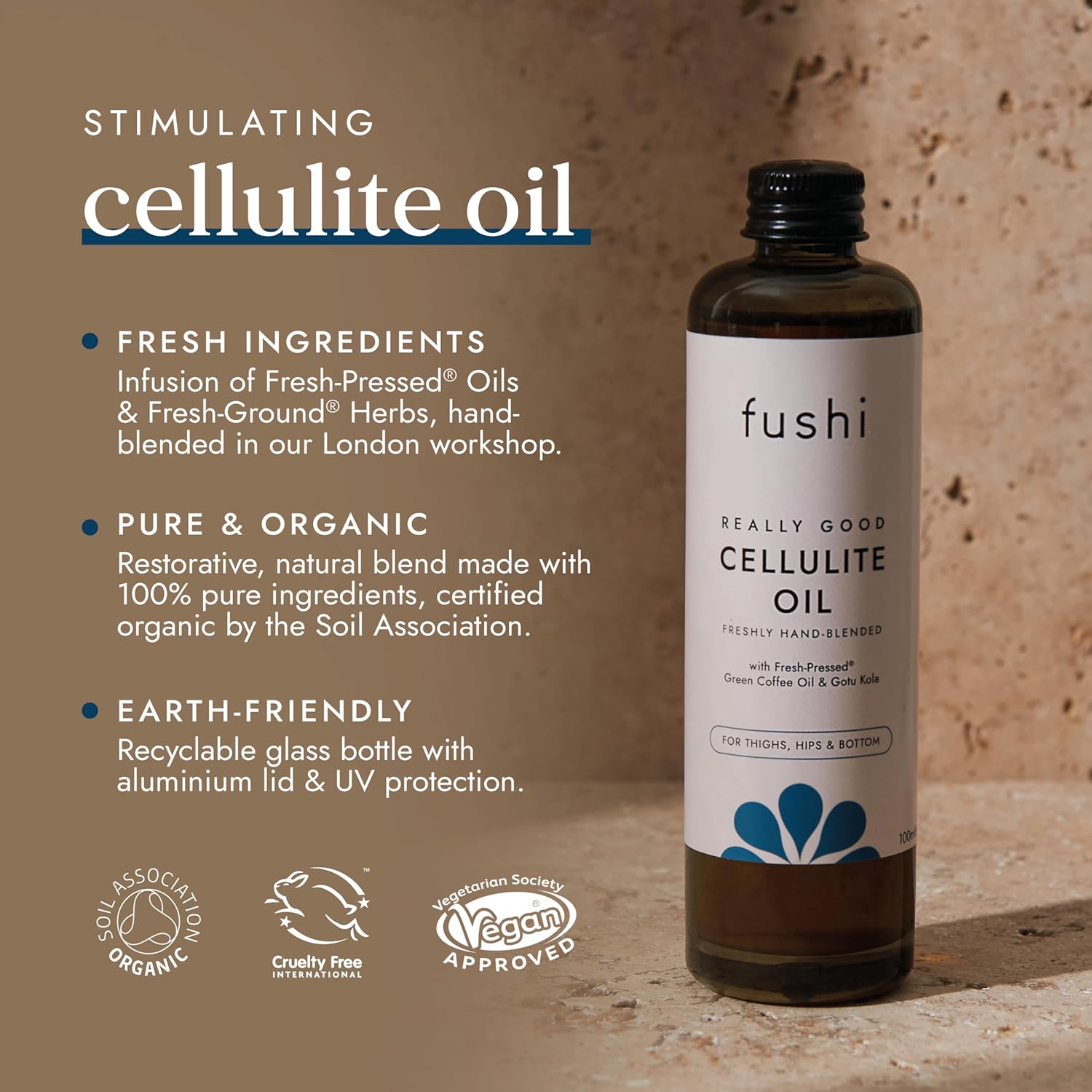 Fushi Cellulite Oil bottle with product details on a brown background