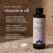 Fushi Vitamin E oil bottle with product details on a wooden background