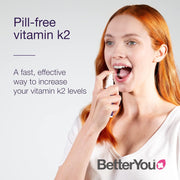 How to Use: BetterYou K2 oral spray in use.